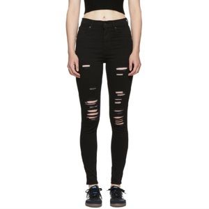 Mile high super skinny ripped black Levis jeans